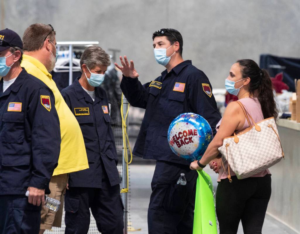 Mathew Gordon waves to fellow firefighters as he leaves the Nevada Task Force 1 Urban Search an ...