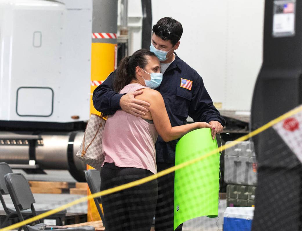 Jessica Gordon welcomes her husband Mathew after he arrived at Nevada Task Force 1 Urban Search ...