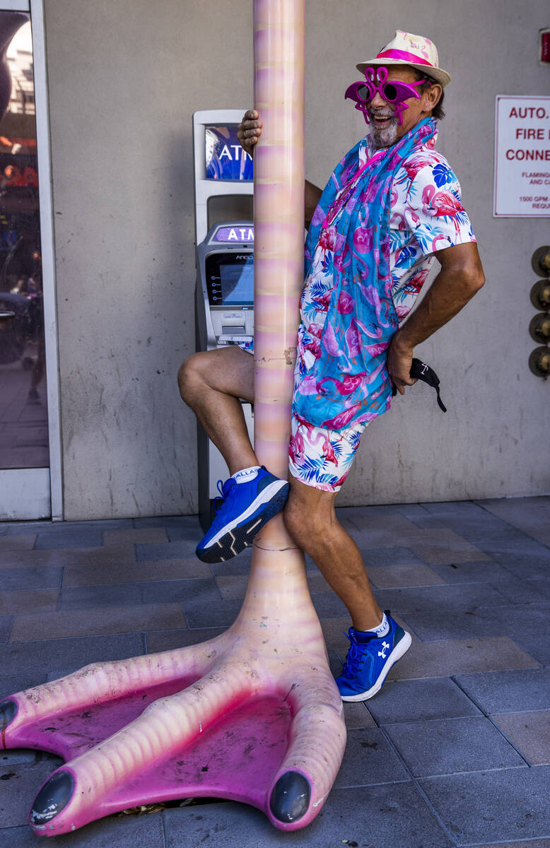 Ernie Previtte of Youngstown, Ohio, pole dances on the flamingoÕs leg at the 1st Annual Fl ...