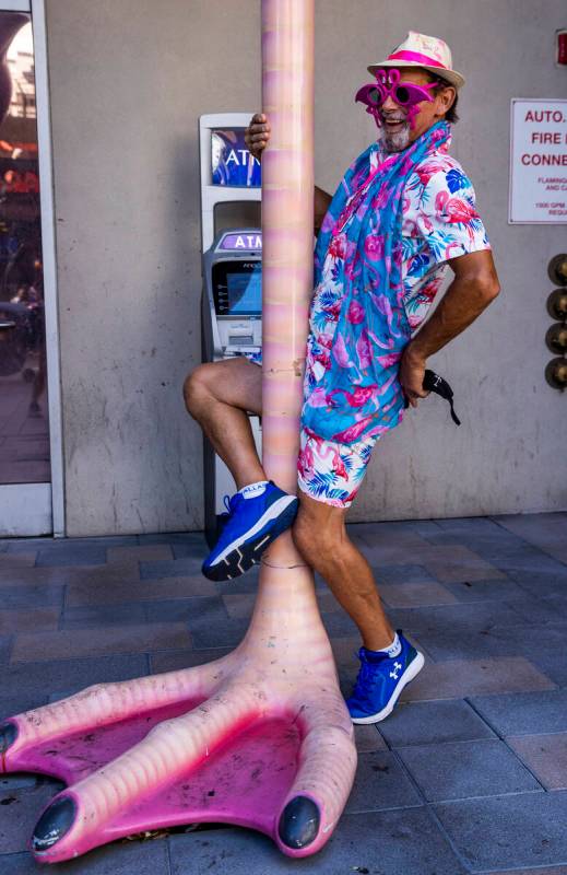 Ernie Previtte of Youngstown, Ohio, pole dances on the flamingoÕs leg at the 1st Annual Fl ...