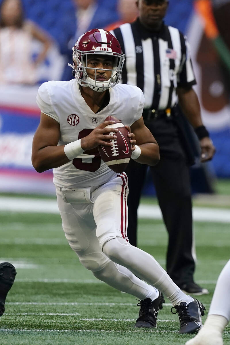 Alabama quarterback Bryce Young (9) looks for an open receiver during the first half of an NCAA ...