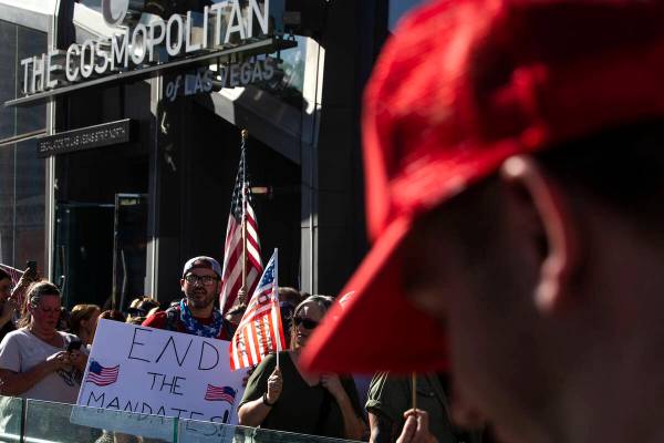 Protesters demonstrate outside of The Cosmopolitan during an anti-mask, anti-vaccination and fr ...