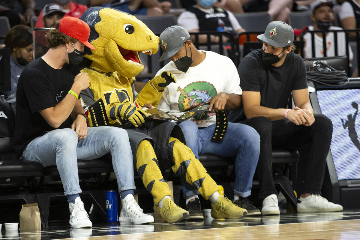 Vegas Golden Knights players Dylan Coghlan, left, the Knights' mascot Chance, Keegan Kolesar an ...