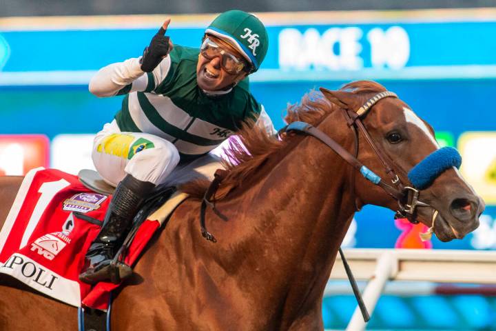 In a photo provided by Benoit Photo, Tripoli and jockey Tiago Pereira win the $1 million TVG Pa ...