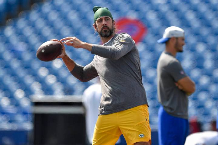 Green Bay Packers quarterback Aaron Rodgers warms up before a preseason NFL football game again ...