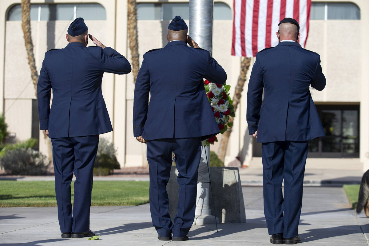 Nellis Air Force Base leadership salute at a wreath-hanging ceremony during the Nellis Fire and ...