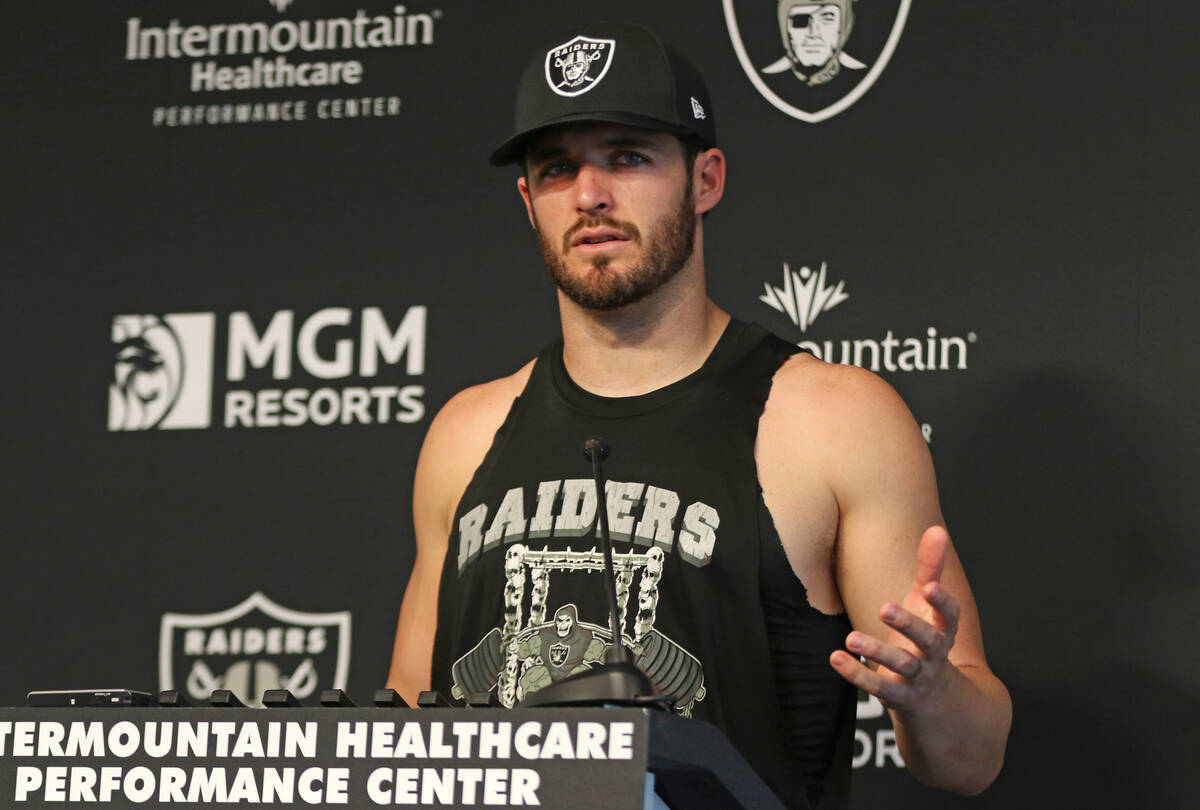 Raiders quarterback Derek Carr answers questions during a news conference at the Raiders Headqu ...