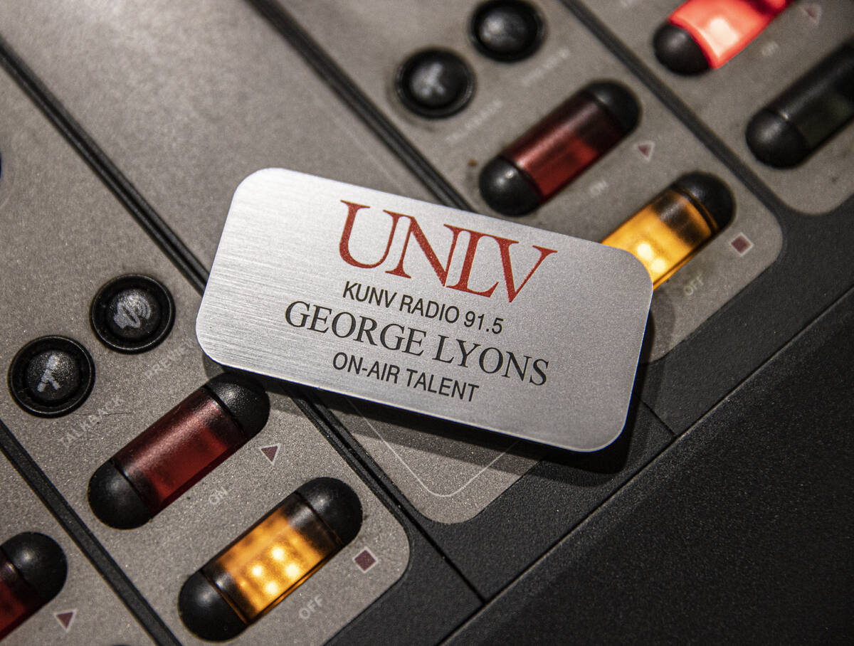George Lyons name tag sits on the soundboard during his radio show "The Lyons' Den" o ...