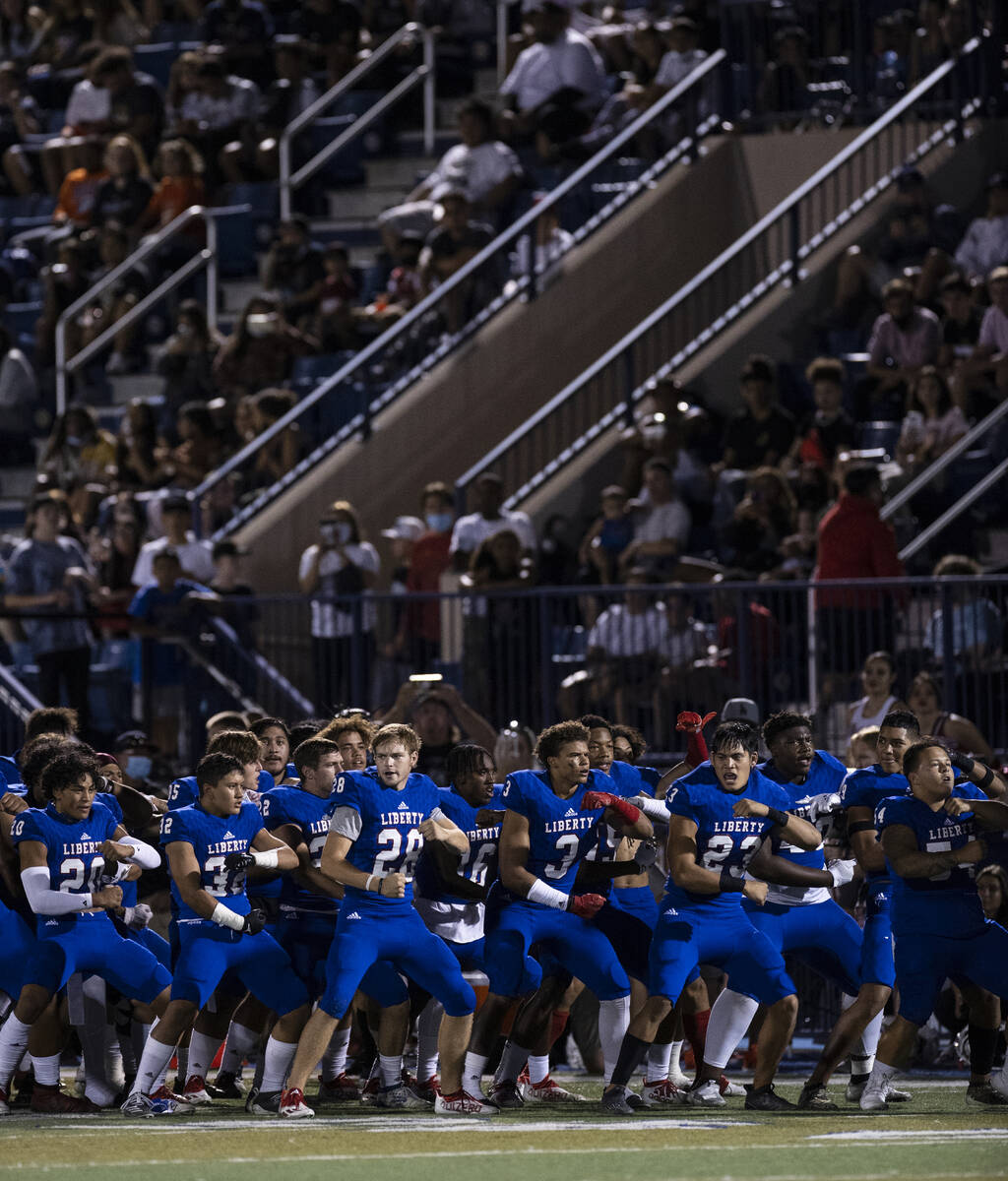 Liberty players perform their ritual before facing Mater Dei during a football game of the Poly ...