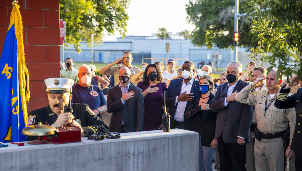 Officials and guests silently participate as retired New York City firefighter Frank Pizarro si ...