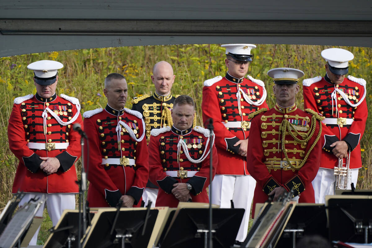 Members of the United States Marine Band observe a moment of silence before performing at the F ...