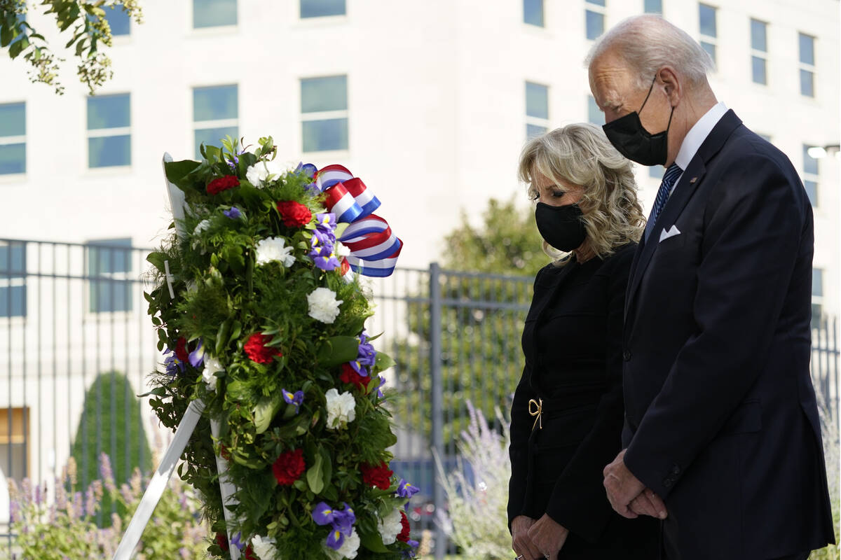 President Joe Biden and first lady Jill Biden participate in a wreath ceremony on the 20th anni ...