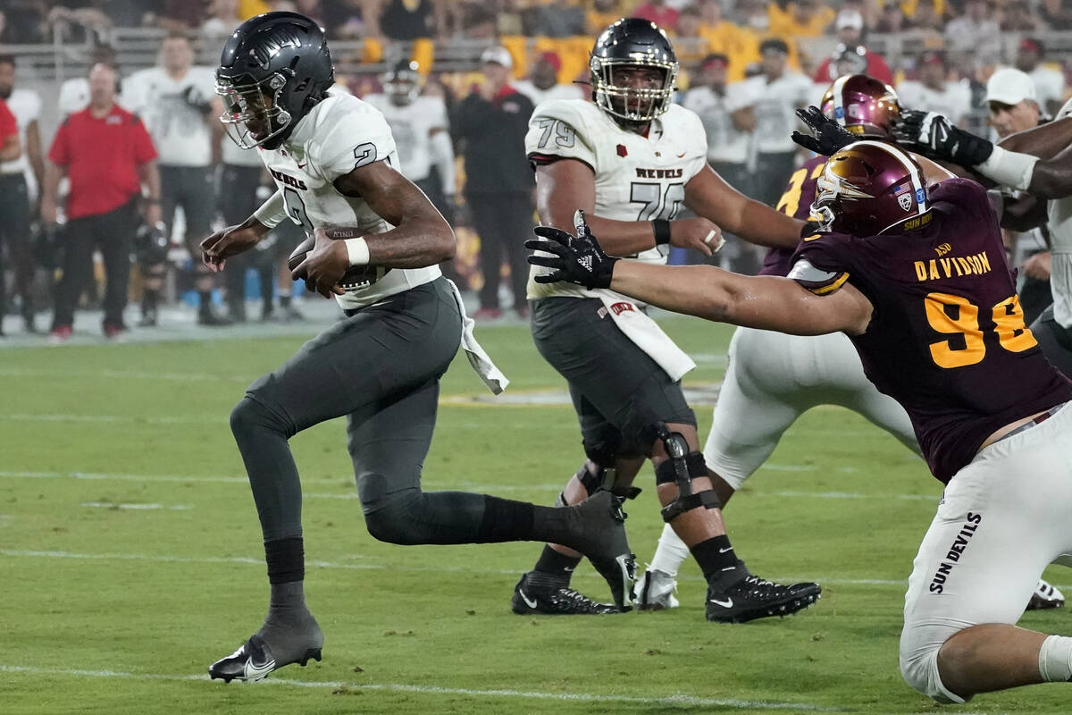 UNLV quarterback Doug Brumfield (2) runs for a touchdown against Arizona State during the first ...