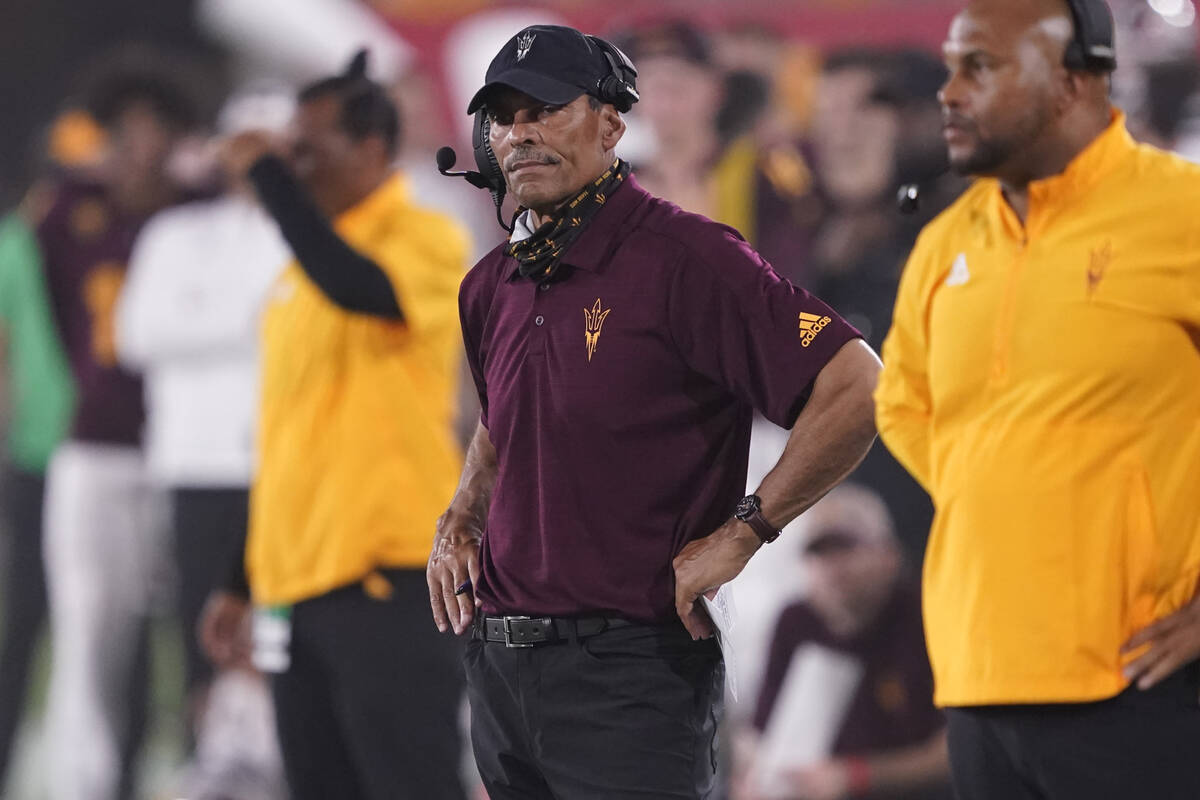 Arizona State head coach Herm Edwards watches his team during the first half of an NCAA college ...