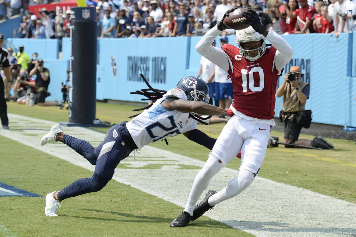 Arizona Cardinals wide receiver DeAndre Hopkins (10) catches a touchdown pass as he is defended ...