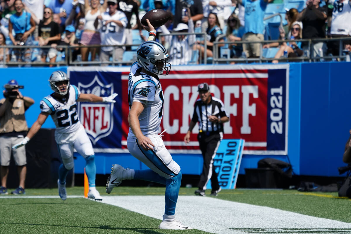 Carolina Panthers quarterback Sam Darnold celebrates after scoring against the New York Jets du ...