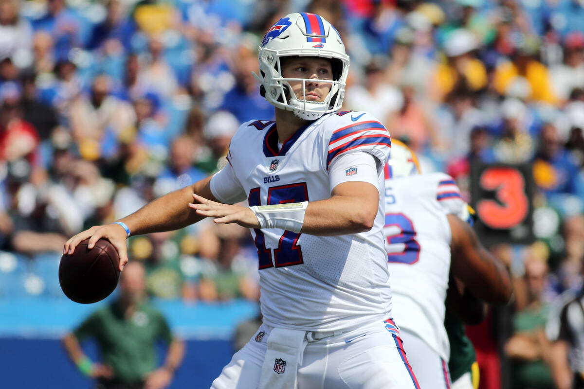 FILE - In this Saturday, Aug. 28, 2021, file photo, Buffalo Bills quarterback Josh Allen throws ...