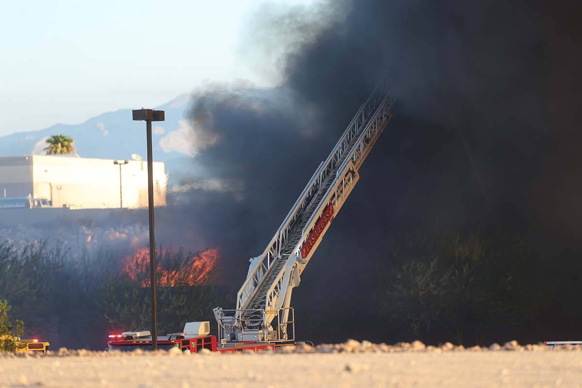 The North Las Vegas Fire Department battles a fire at a Republic Services recycling facility on ...