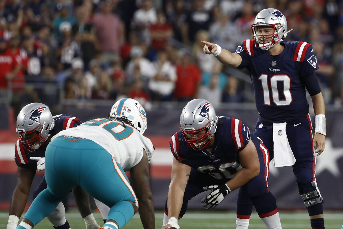 New England Patriots quarterback Mac Jones (10) during the second half of an NFL football game, ...