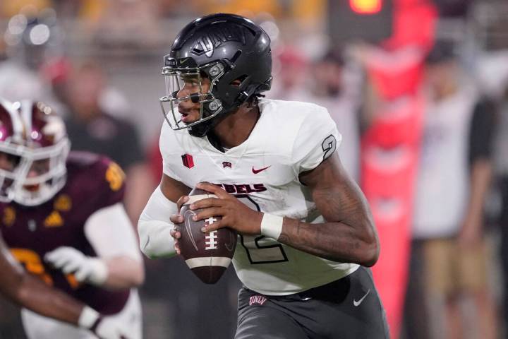 UNLV quarterback Doug Brumfield (2) looks to throw against Arizona State during the first half ...