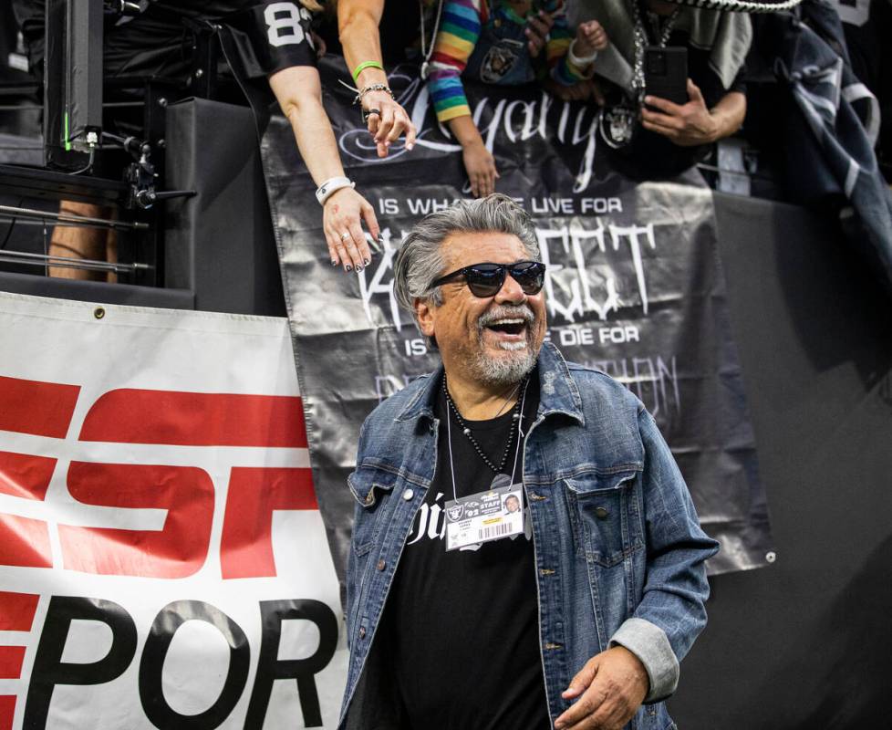 Raiders fan and celebrity comedian George Lopez cheers for Las Vegas during an NFL football gam ...