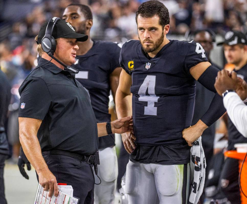 Raiders Head Coach John Gruden has a serious conversation with Raiders quarterback Derek Carr ( ...