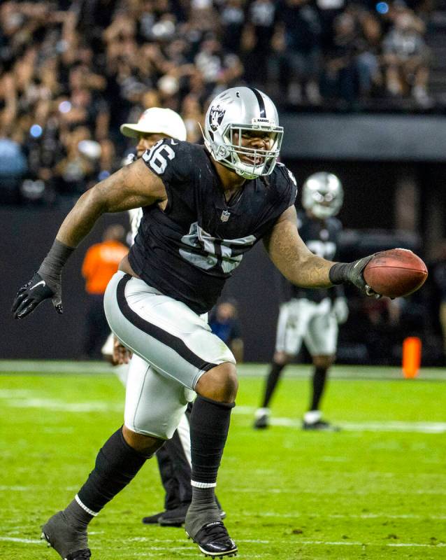 Raiders defensive tackle Darius Philon (96)celebrates his fumble recovery in overtime versus th ...