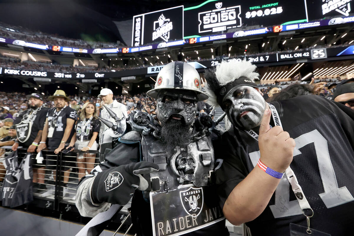 Fans, including Javier "Radier Javi" Reyna of West Covina, Calif., left, and Tony Vas ...