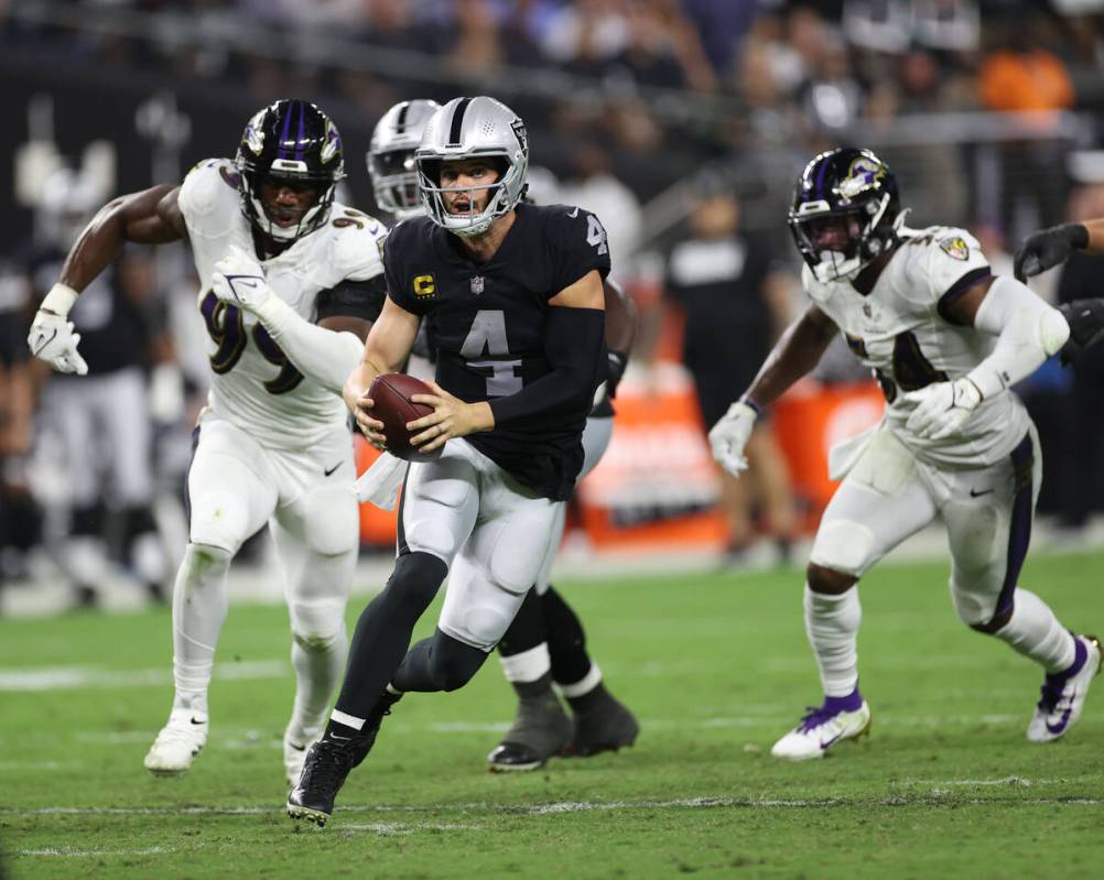 Raiders wide receiver Bryan Edwards (89) tires to catch a ball against Baltimore Ravens cornerb ...