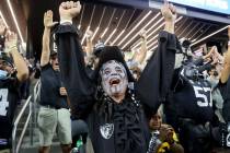 Raiders fans celebrate their overtime win in the season-opener against the Baltimore Ravens at ...