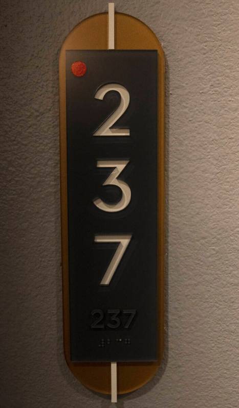 Room number sign is seen outside a one-bedroom apartment at Auric Symphony Park, the first luxu ...