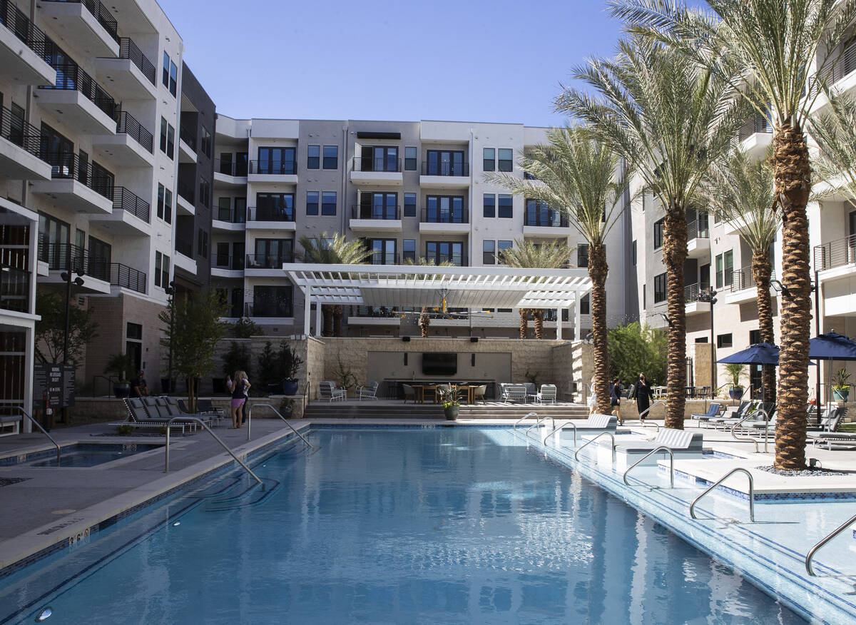 Swimming pool area at Auric Symphony Park, the first luxury multifamily residential community a ...