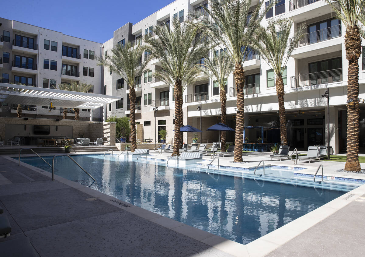 Swimming pool area at Auric Symphony Park, the first luxury multifamily residential community a ...