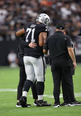 Las Vegas Raiders offensive guard Denzelle Good (71) is carried off the field during the first ...