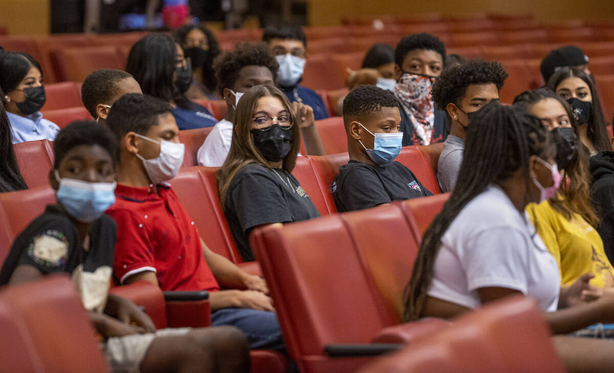 Participants listen to speakers during a youth mental health conversation as part of the city's ...