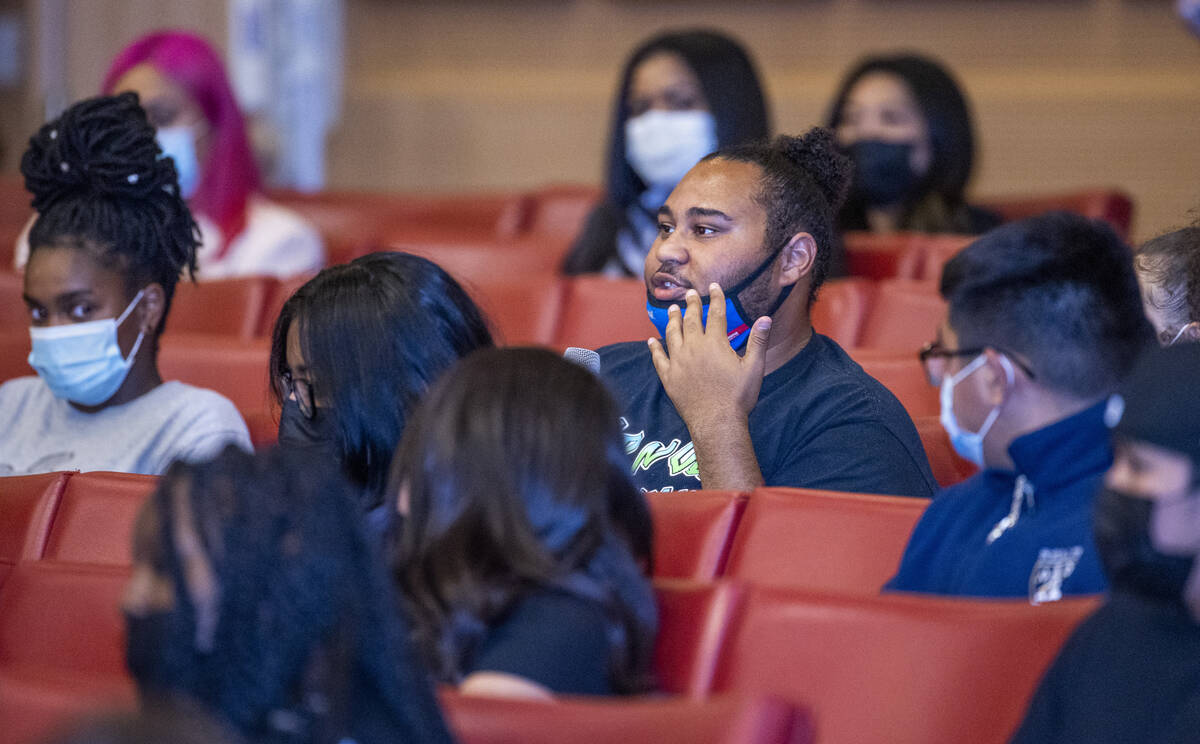 A participant answers a question during a youth mental health conversation as part of the city' ...