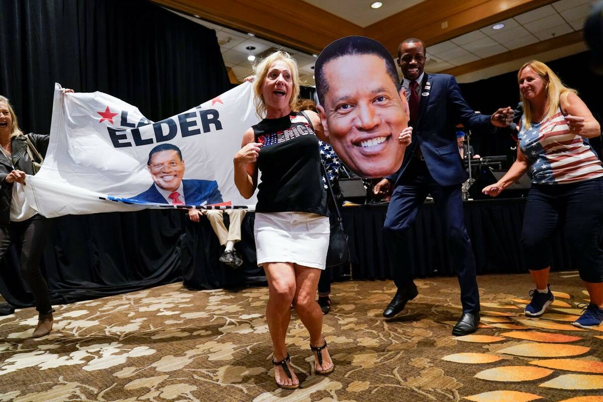 Supporters of Republican conservative radio show host Larry Elder gather as polls close for the ...