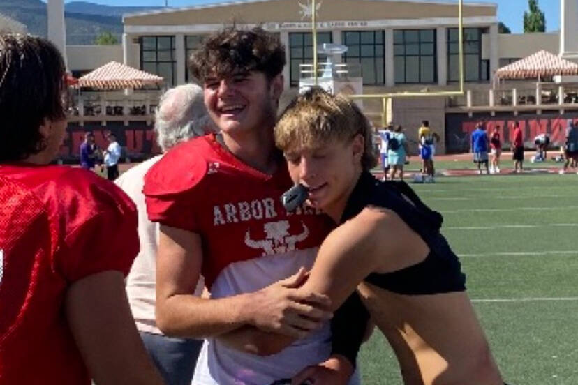 Christian Thatcher, left, a freshman linebacker at Arbor View, receives congratulations from Pa ...