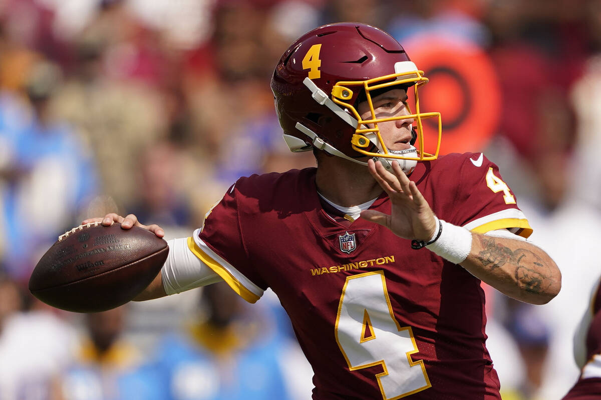 Washington Football Team quarterback Taylor Heinicke (4) throws the ball during the first half ...