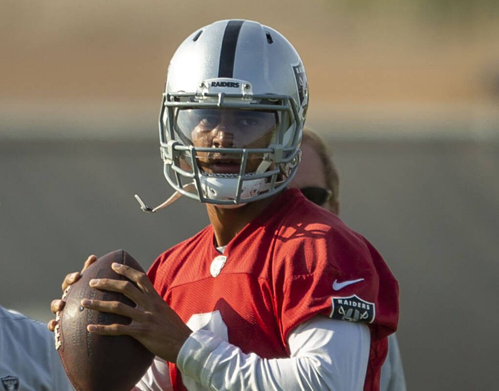 Raiders quarterback Marcus Mariota (8) prepares to throw during an NFL football practice on Tue ...