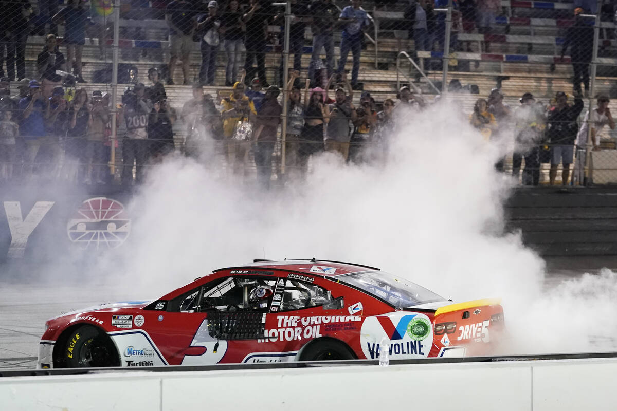 Kyle Larson does a burnout after winning a NASCAR Cup Series auto race at Bristol Motor Speedwa ...