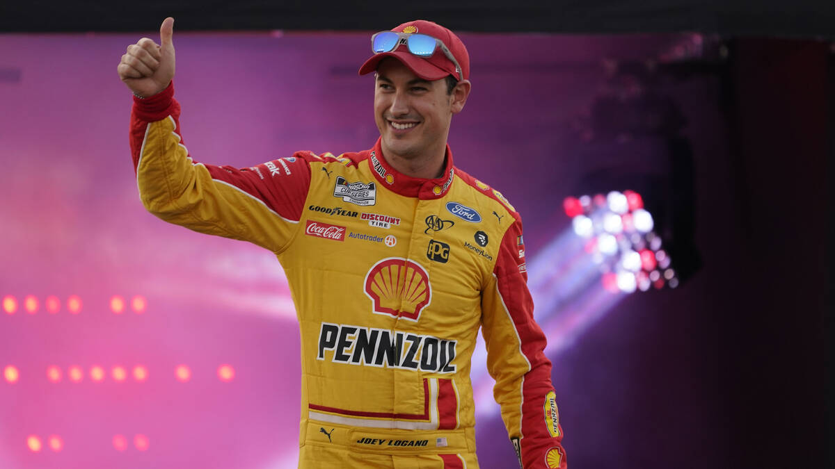 Joey Logano waves to the crowd during driver introductions prior to the start of the NASCAR Cup ...