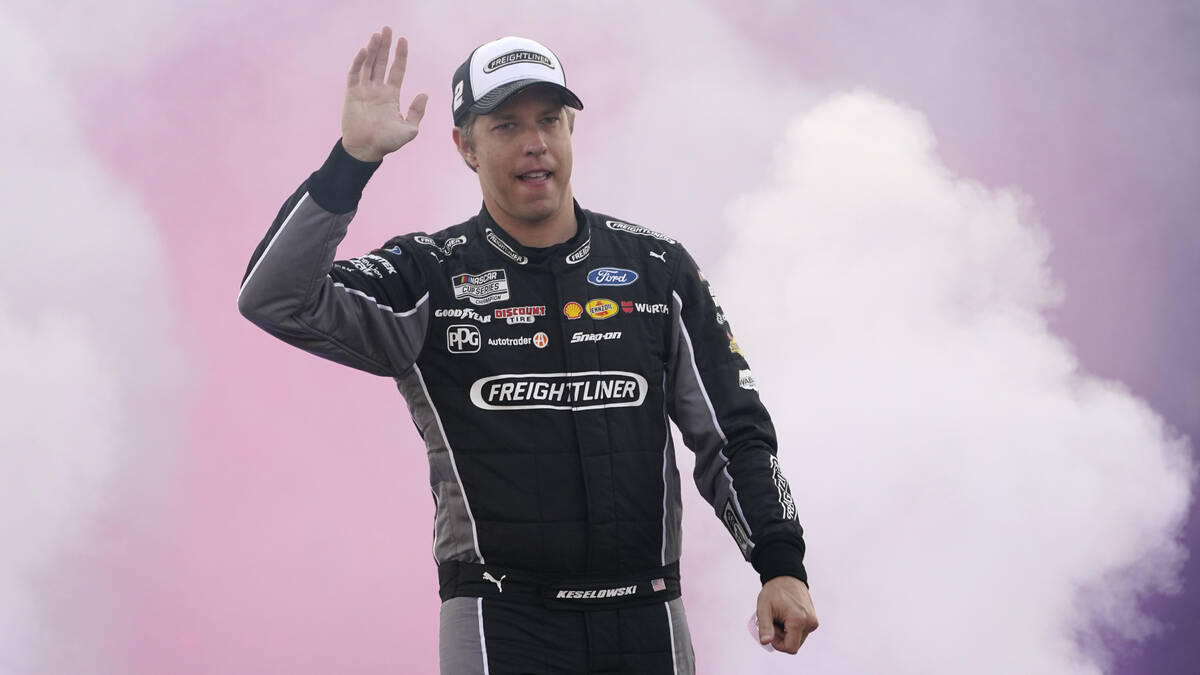 Brad Keselowski waves to the crowd during driver introductions prior to the start of the NASCAR ...