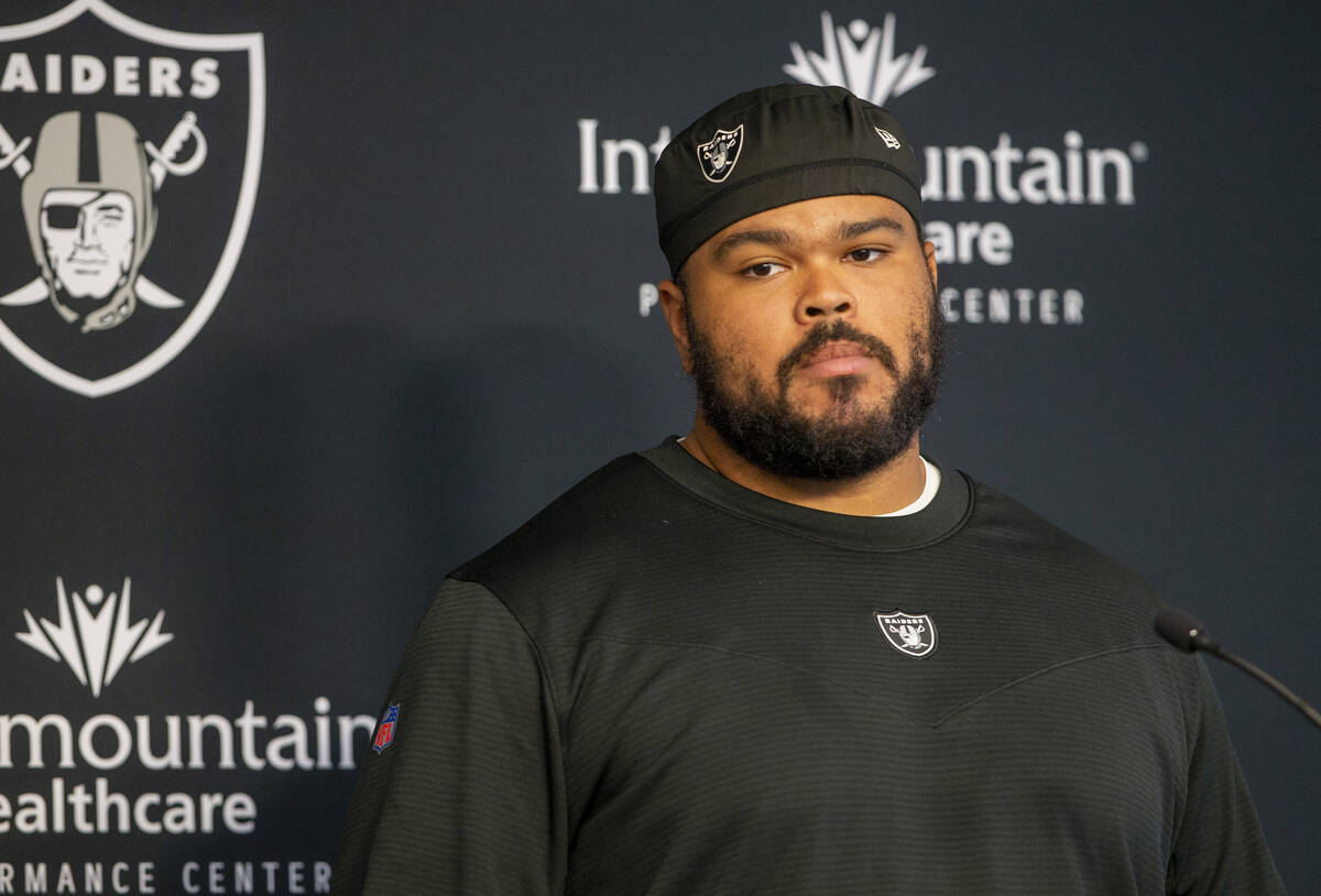 Raiders offensive tackle Jermaine Eluemunor (72) takes questions during team practice at the Ra ...