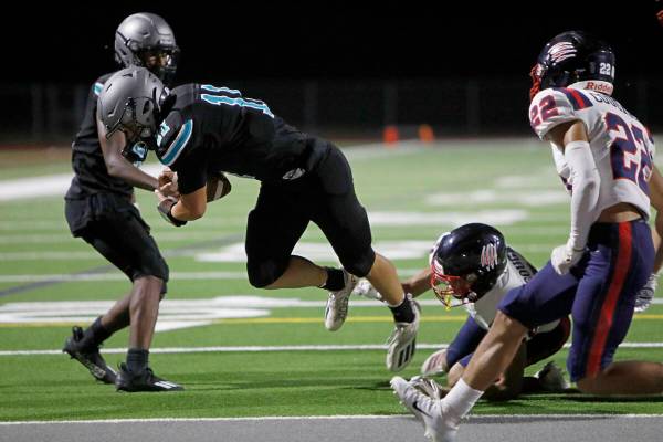 Silverado High School's Brandon Tunnell (11) scores a touchdown over Coronado High School's Pre ...