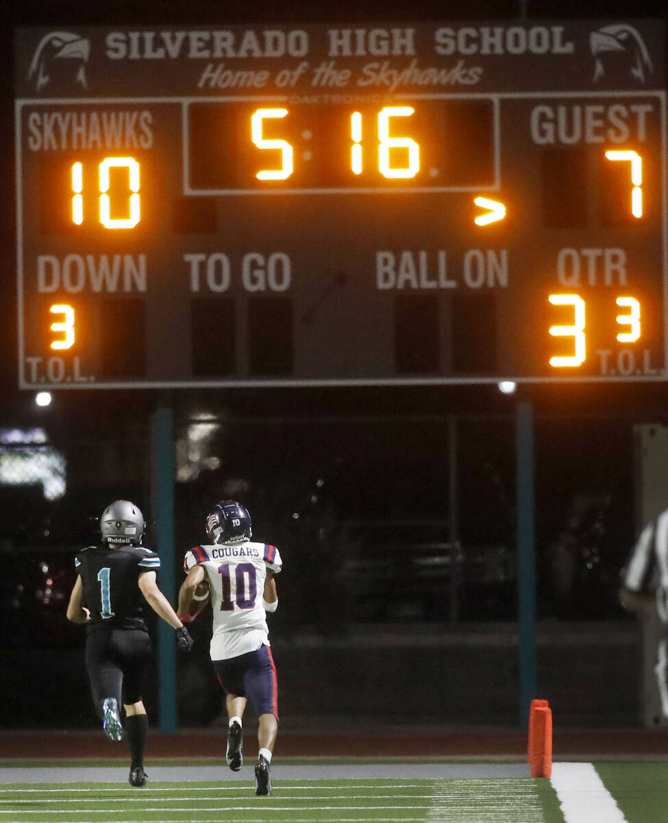 Coronado High School's Jaylen Garrison (10) runs into the end zone for a touchdown as Silverado ...