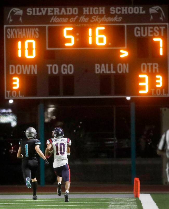 Coronado High School's Jaylen Garrison (10) runs into the end zone for a touchdown as Silverado ...