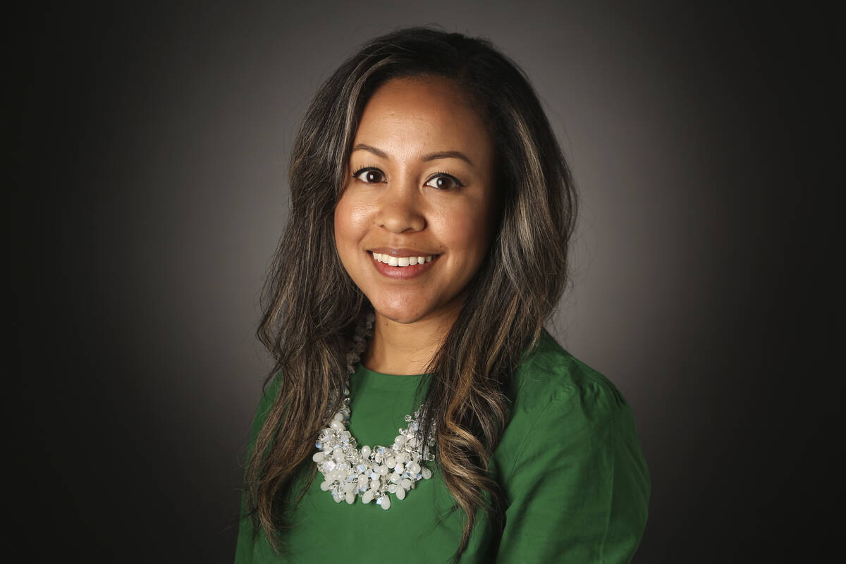 Business retail reporter Subrina Hudson poses for a portrait in the RJ studio on Wednesday, Aug ...