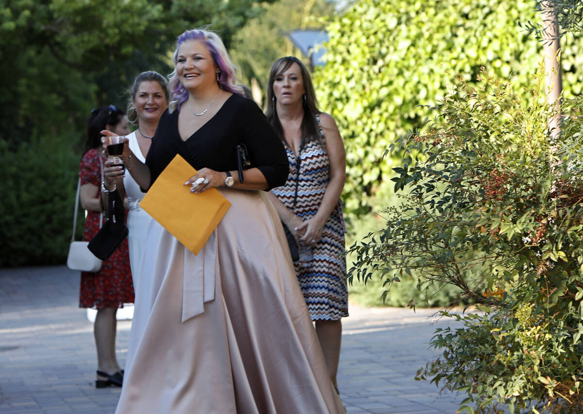 Kristin Bell-Peistrup, center, greets guests during a celebration of life marking the one-year ...