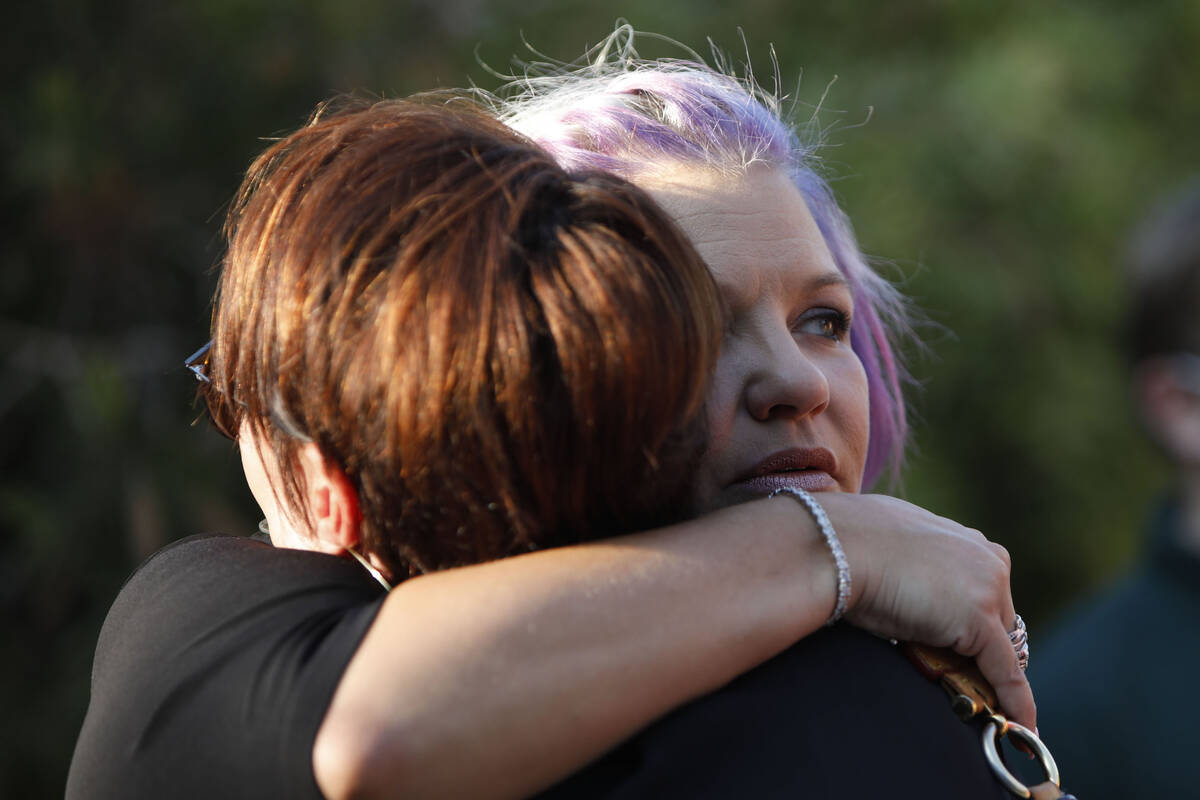 Kristin Bell-Peistrup, face to camera, hugs Kelly Dunagan of Las Vegas during a celebration of ...